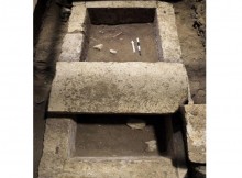 The skeletal remains were found both inside and outside the rectangular stone-lined cist (pictured), under the floor of the cavernous, vaulted structure that is 26 feet (eight metres) tall. They are undergoing DNA analysis