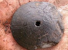 This is one of four clay disks found at Noatak National Preserve in northwestern Alaska. Photo by Scott Shirar, University of Alaska Museum of the North