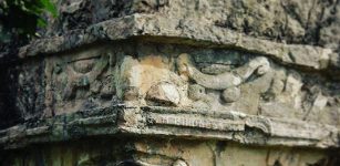 Face of the God of Creation, Itzamna, carved into the wall of a temple, Tulum, Mexico