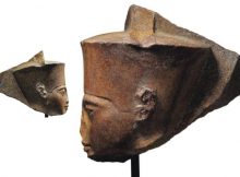 This image released by Christie's on Tuesday, June 11, 2019, shows a 3,000-year-old stone sculpture of the famed boy pharaoh Tutankhamun at Christie's in London. Egypt is trying to halt the auction of the sculpture of Tutankhamun at Christie's in London. The Foreign Ministry issued a statement late on Monday saying Egyptian authorities demand the auction house provide documents proving the artifact's ownership. (Christie's via AP)