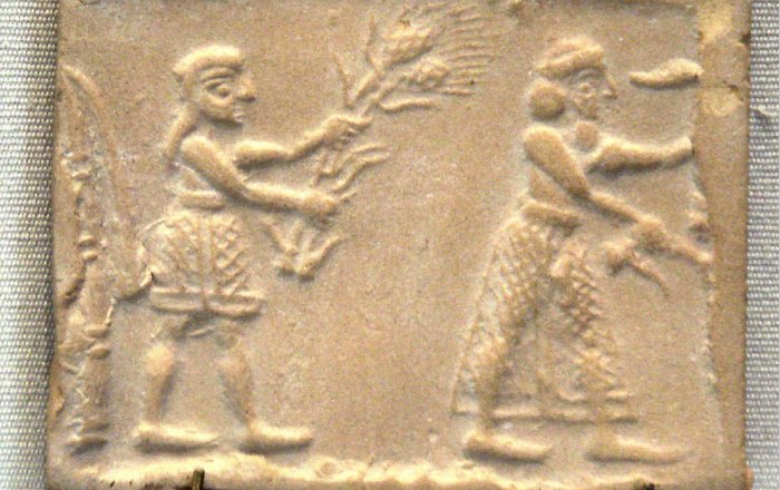 Sumerian cylinder seal impression dating to c. 3200 BC, showing an ensi and his acolyte feeding a sacred herd.