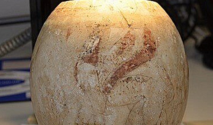 A decorated egg from the Isis Tomb, Vulci, Italy, under examination. Credit: (© Tamar Hodos, University of Bristol (with the permission of the Trustees of the British Museum)