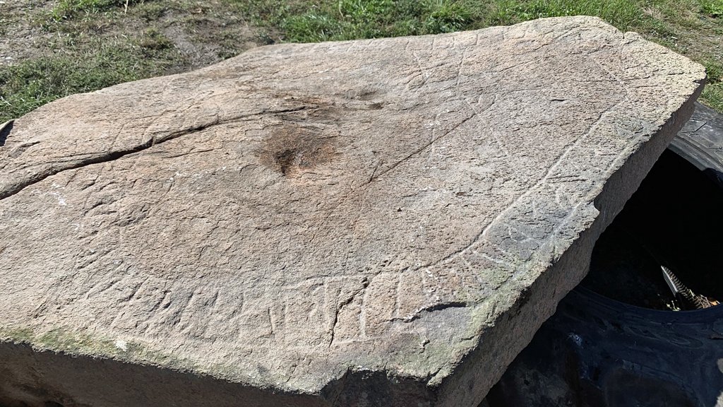 Unique Viking Age Runestone With A Cross And Animal Biting Its Own Tail Discovered By Farmer In Sweden