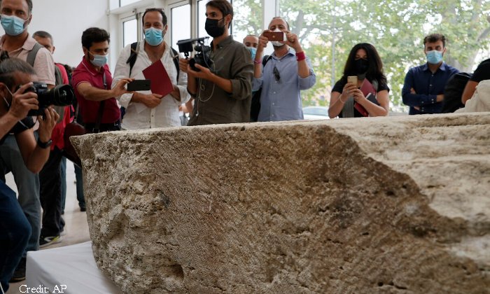 Photographers take pictures during the presentation to the press of an archeological finding that emerged during the excavations at a Mausoleum in Rome, Friday, July 16, 2021. (AP Photo/Domenico Stinellis)