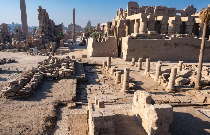 Rare Stone Stela Of Emperor Tiberius Standing Before The Theban Triad, Unearthed During Restoration Of The Gate Of Ramses III at Karnak, Egypt Rare Stone Stela Of Emperor Tiberius Standing Before The Theban Triad, Unearthed During Restoration Of The Gate Of Ramses III at Karnak, Egypt